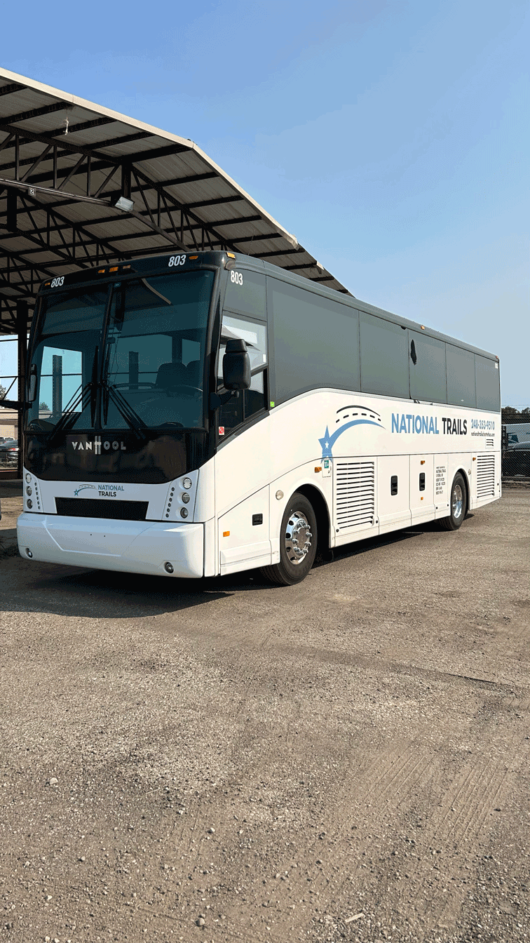 luxury Van Hool 35-passenger charter bus left exterior
