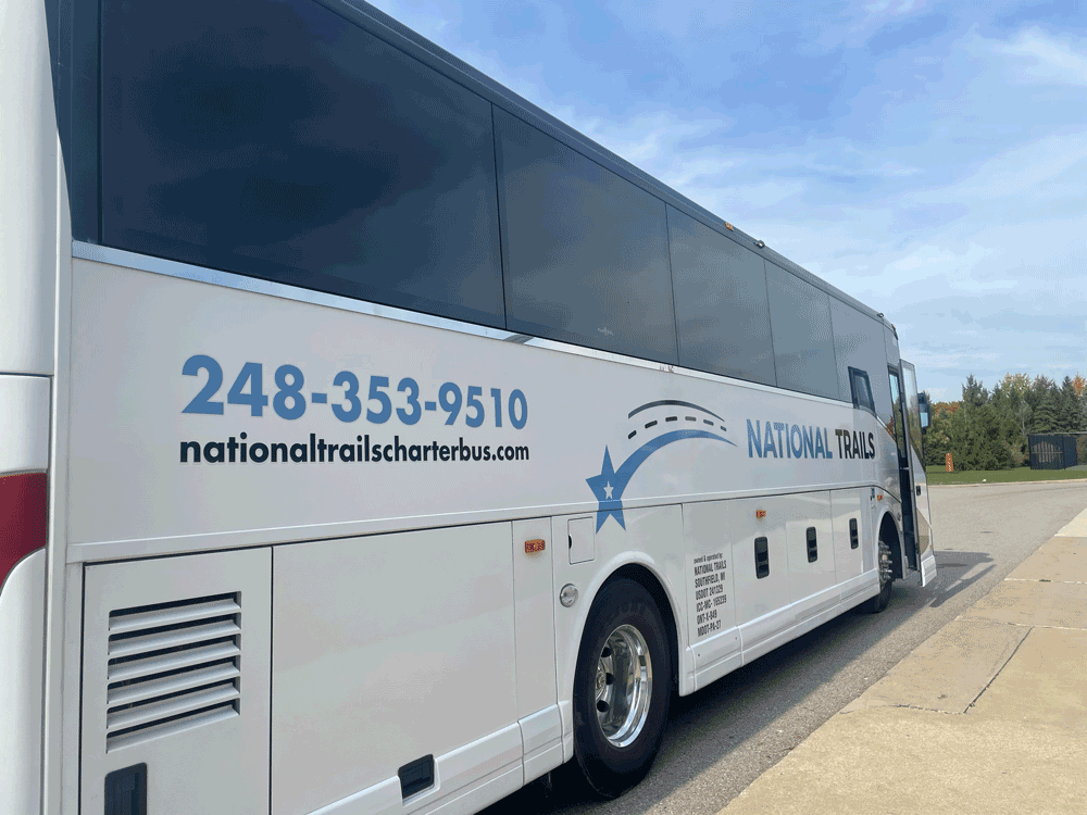 luxury Van Hool 35-passenger charter bus rear exterior