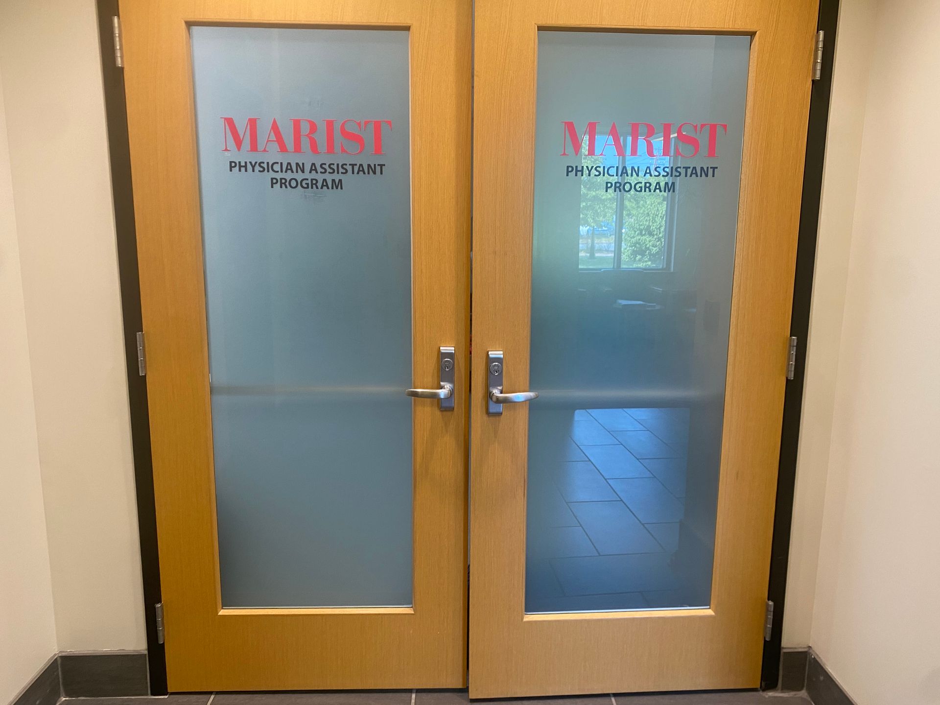 A pair of doors that say marist on them