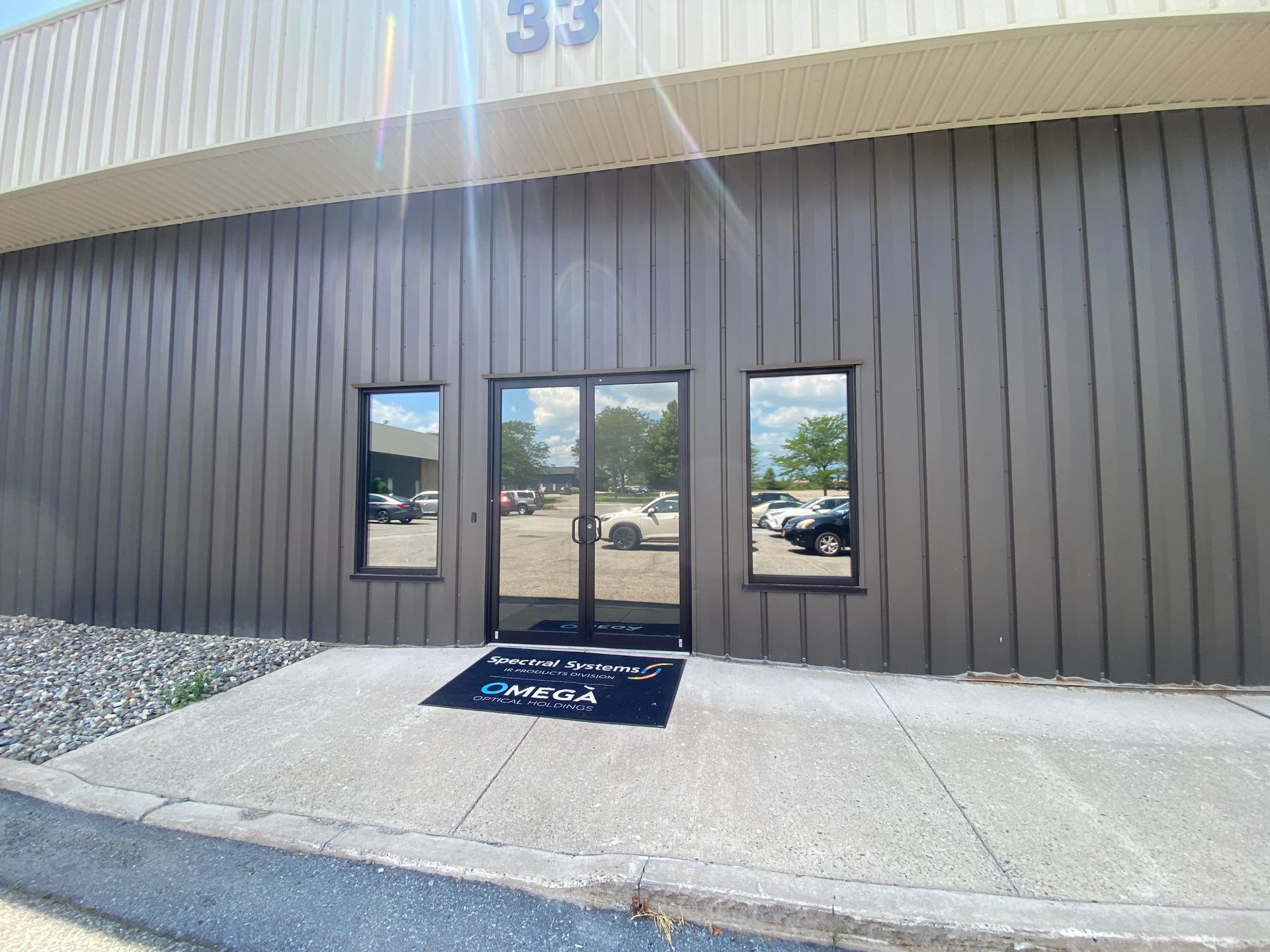 The front door of a building with the number 33 on it