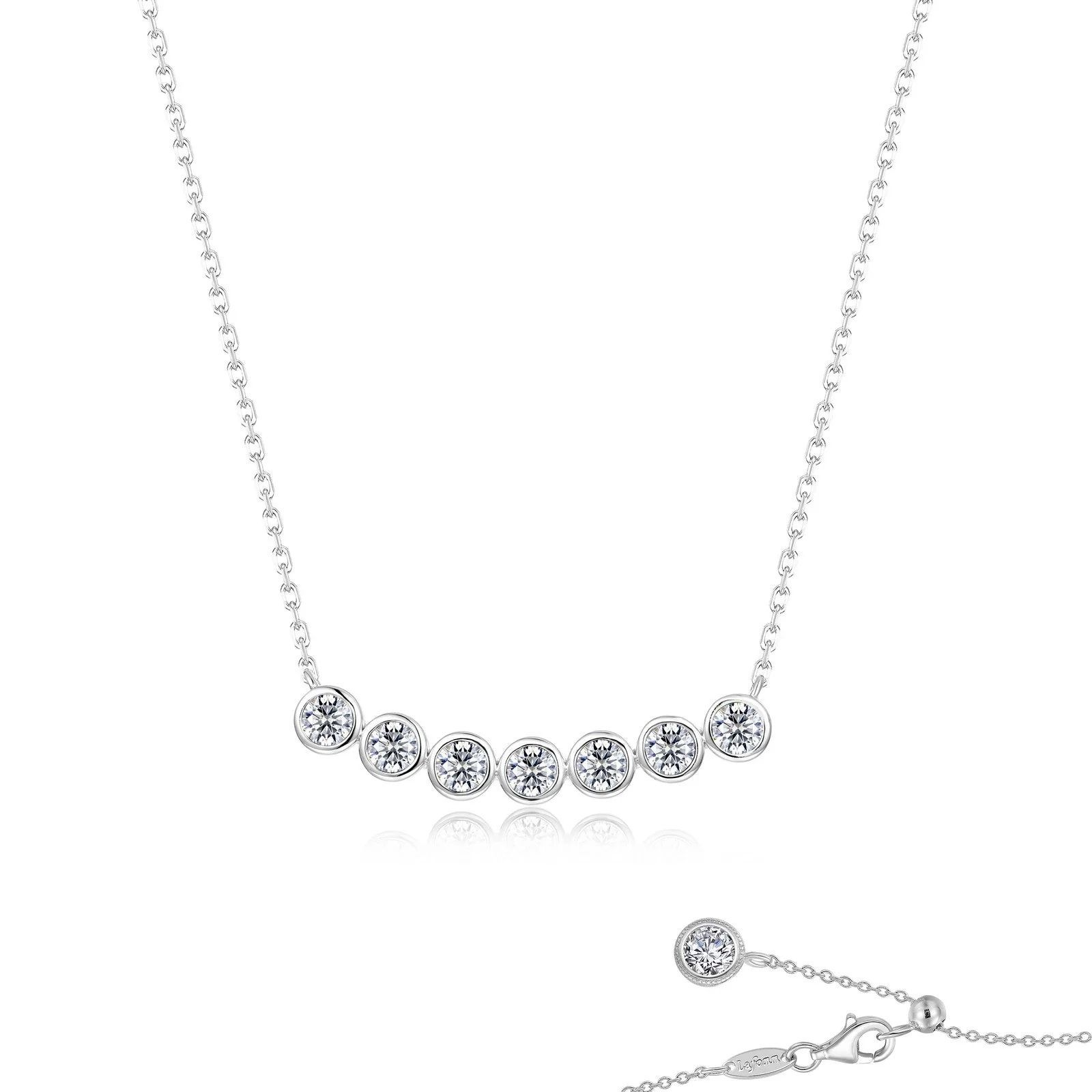 Silver necklace with seven round, sparkling stones arranged in an arc.