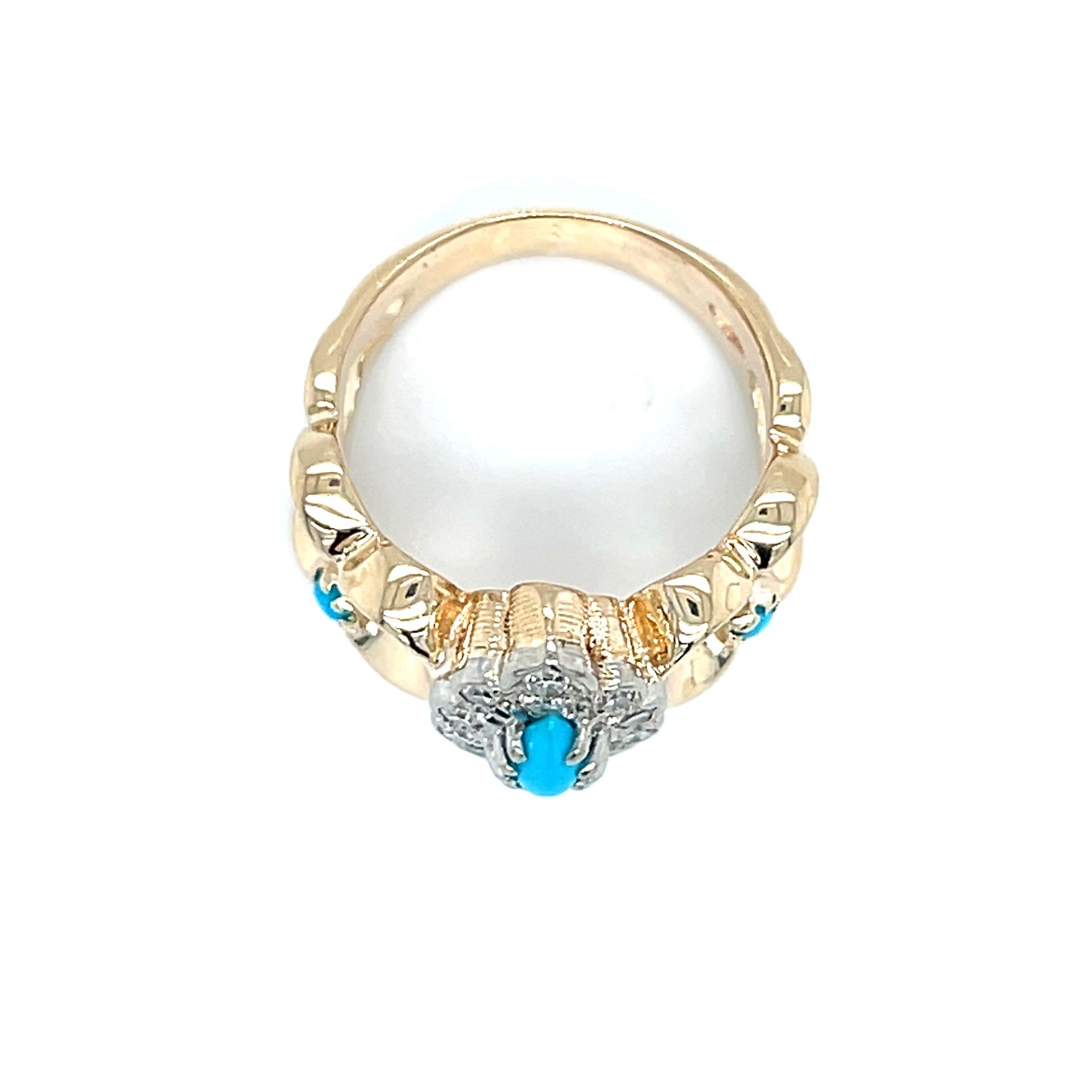 Gold ring with a turquoise stone and diamond accents.