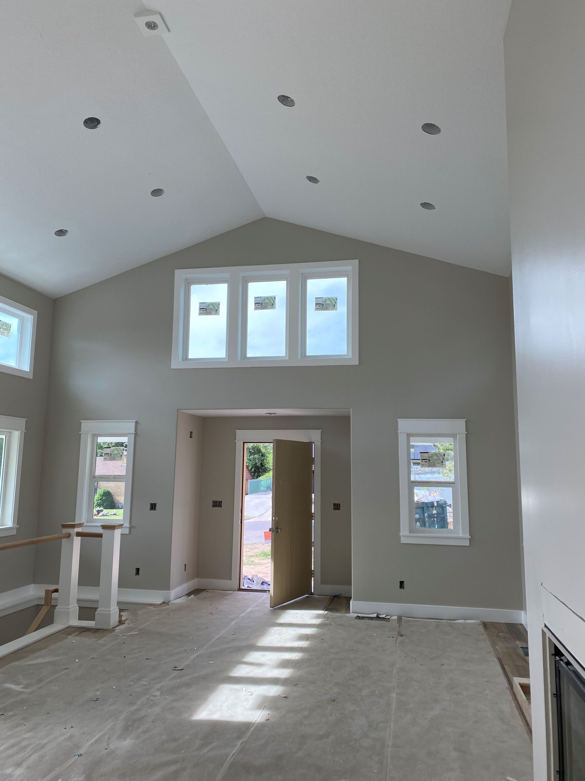 A living room with lots of windows.