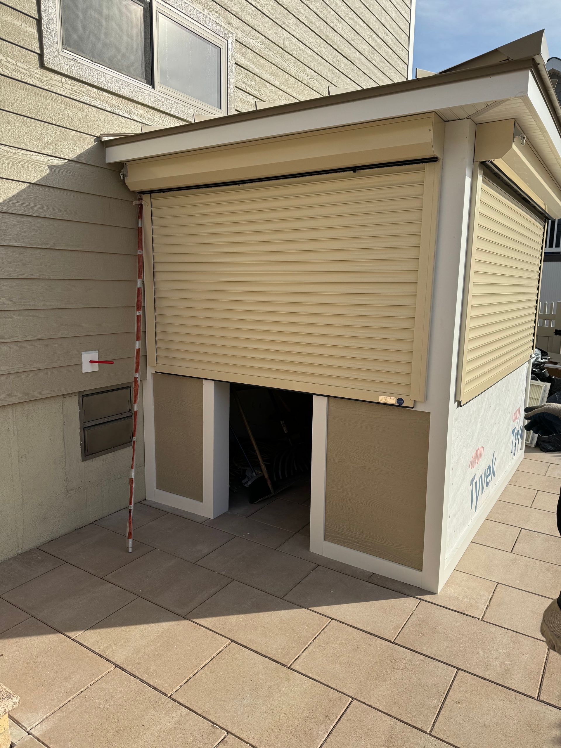 A building with a shutter on the side of it