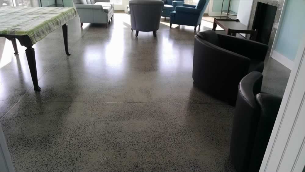 A living room with a table chairs and a fireplace