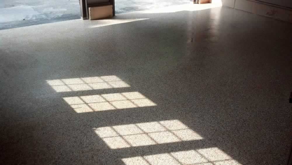 The sun is shining through the windows on the floor.