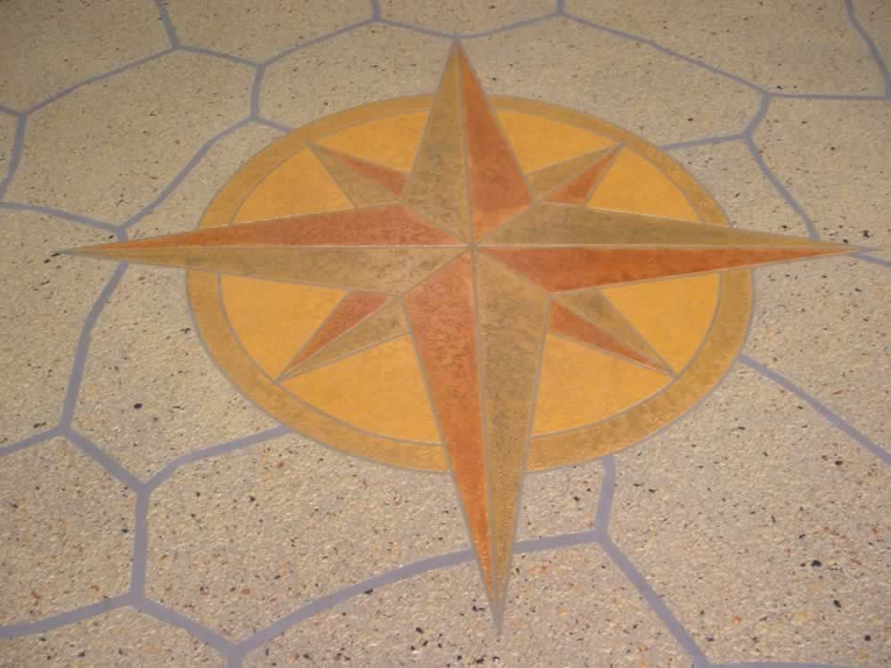A compass rose is painted on the floor of a building