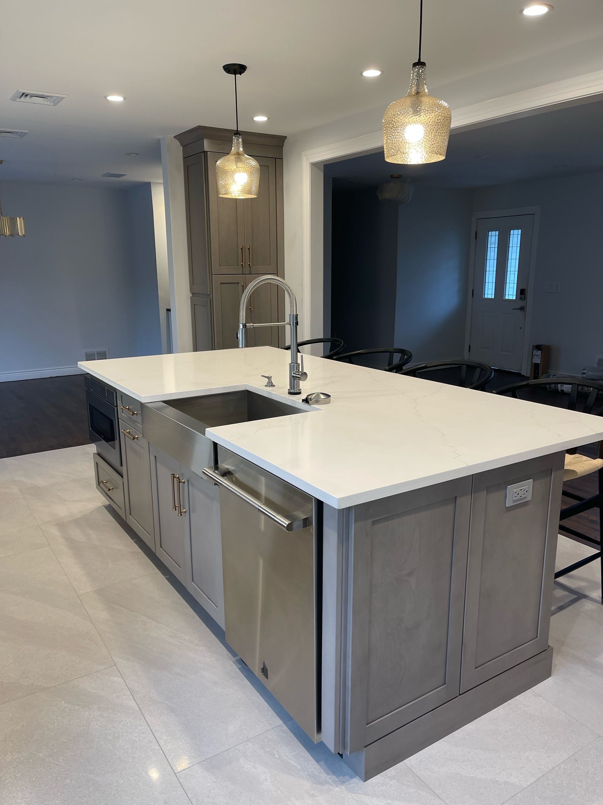 A kitchen with a large island and a sink