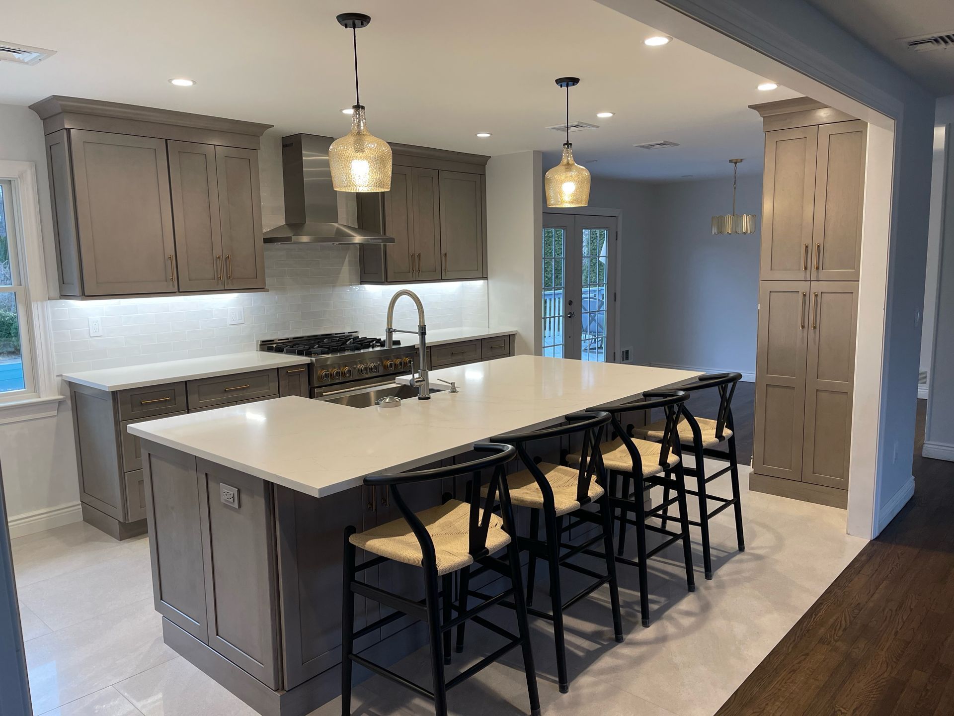 There is a large island in the middle of the kitchen.