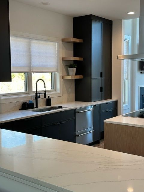 kitchen sink with black fixtures