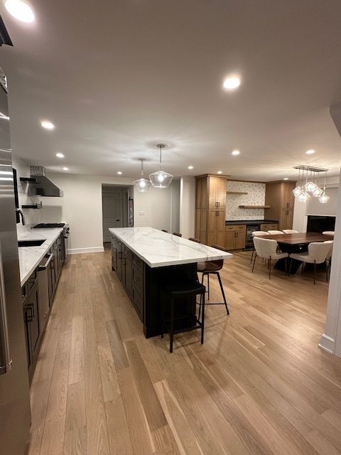 A kitchen with a large island in the middle of the room.
