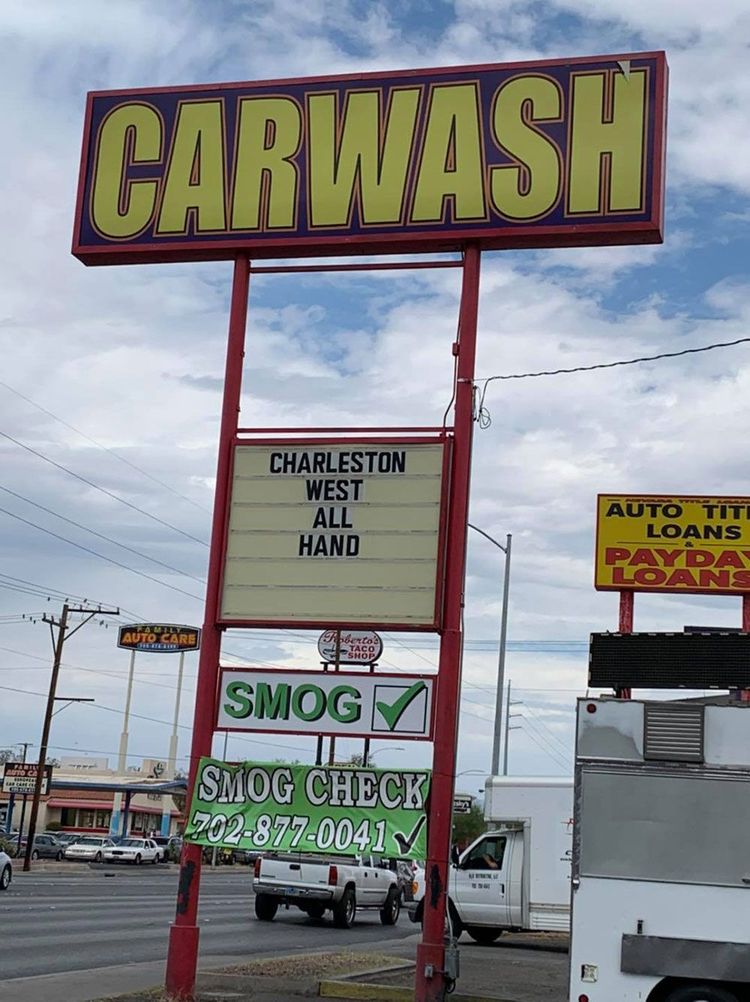 A sign for a car wash in charleston west all hand