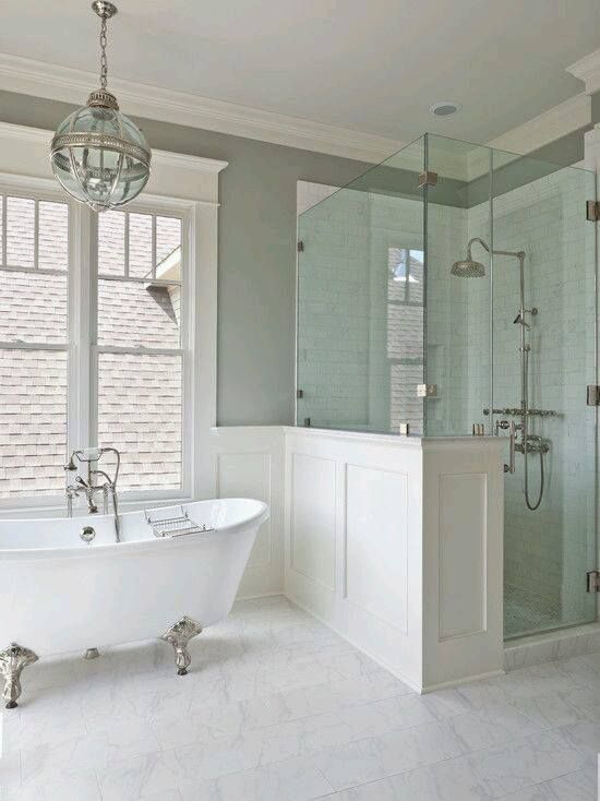 a bathroom with a tub and a walk in shower