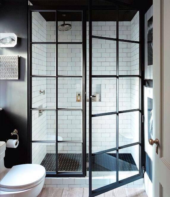 a bathroom with a toilet and a walk in shower