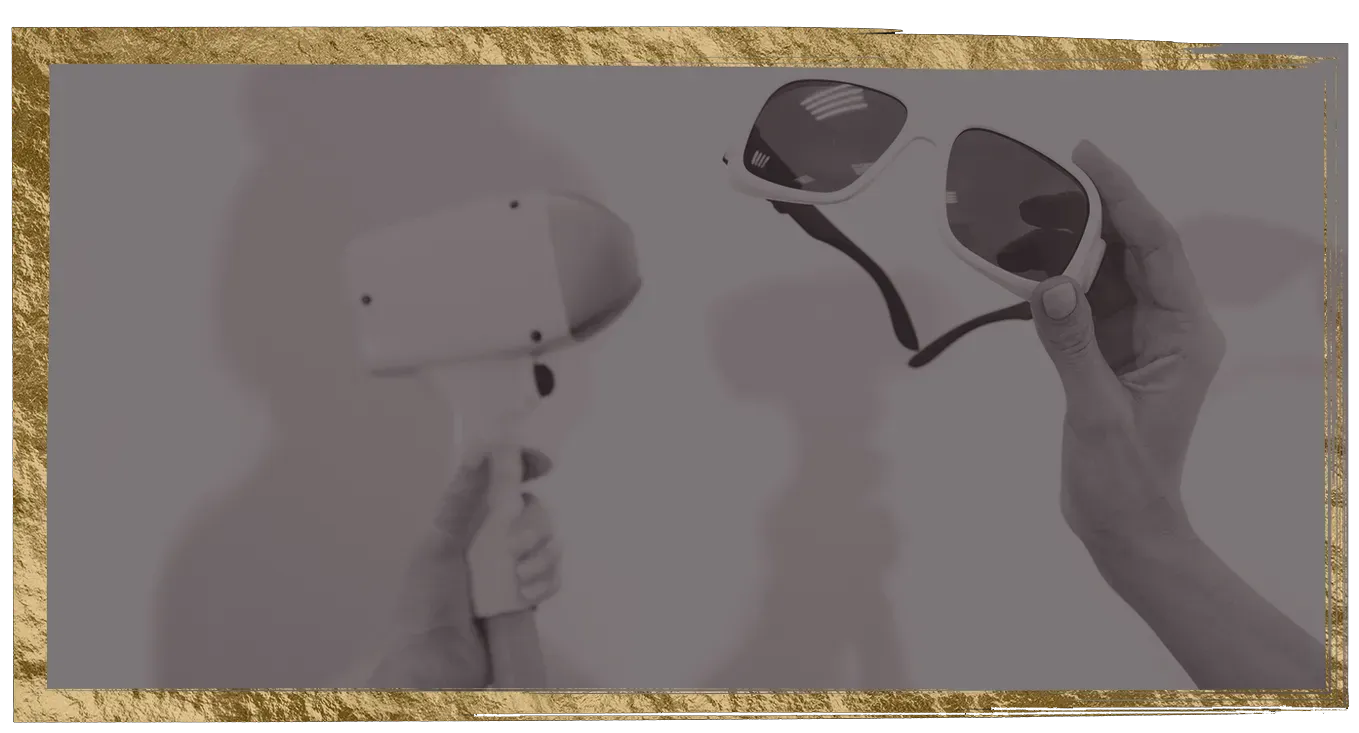 Two hands holding a white flip-flop and black sunglasses against a light wall.
