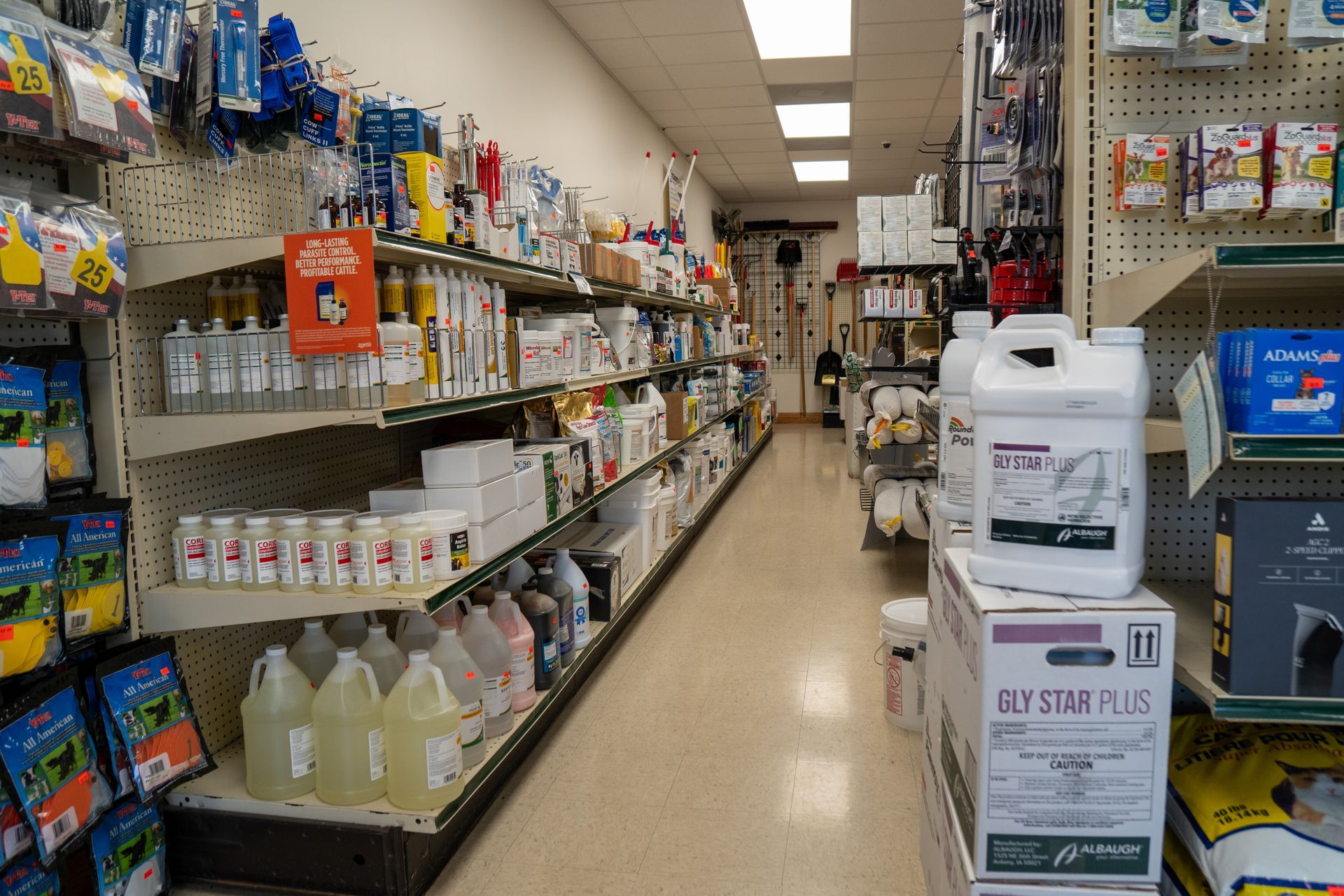 Interior aisle of a store, shelves stocked with various products. Products are white, blue, and yellow.