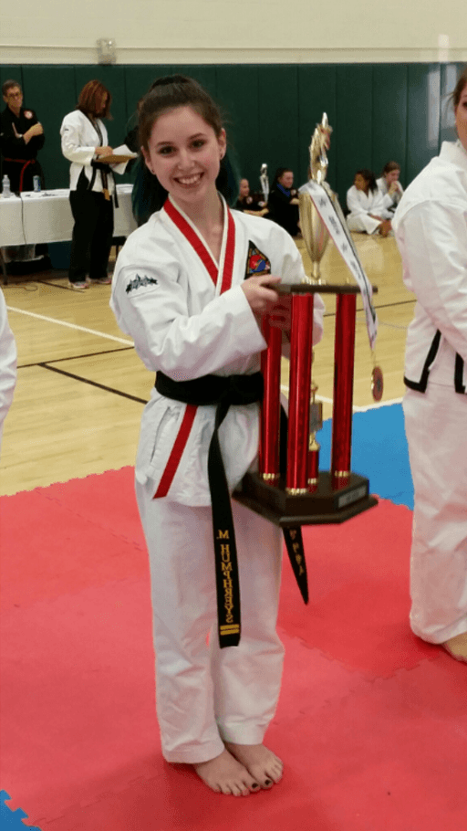 Young lady holding her trophy