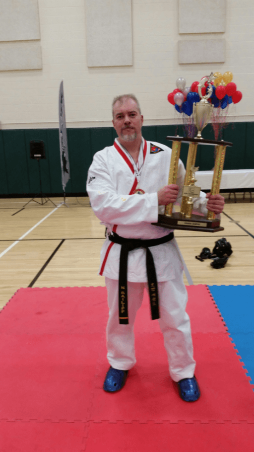 Adult guy holding his trophy