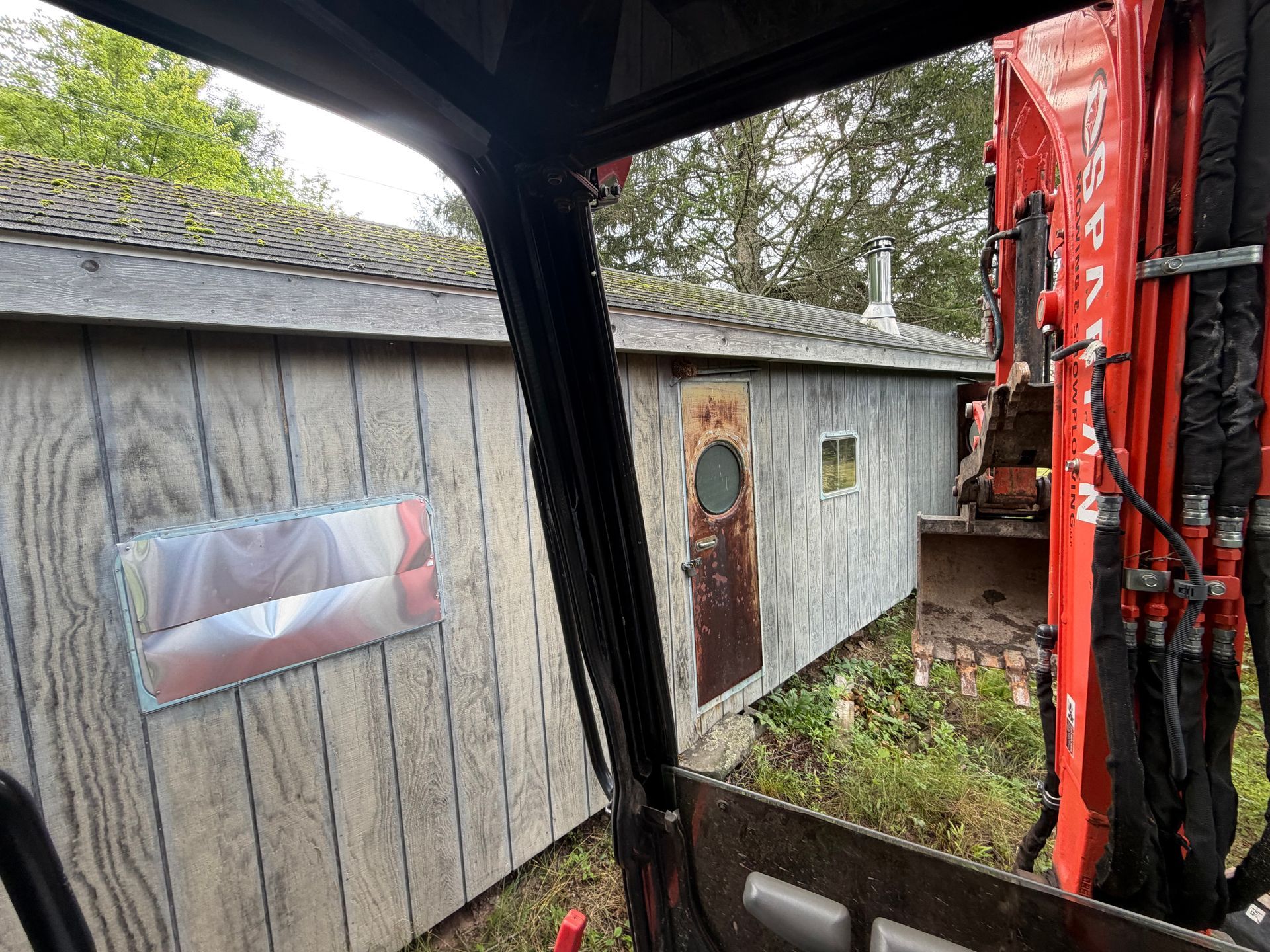 Heavy Equipment demolishing a mobile home POV