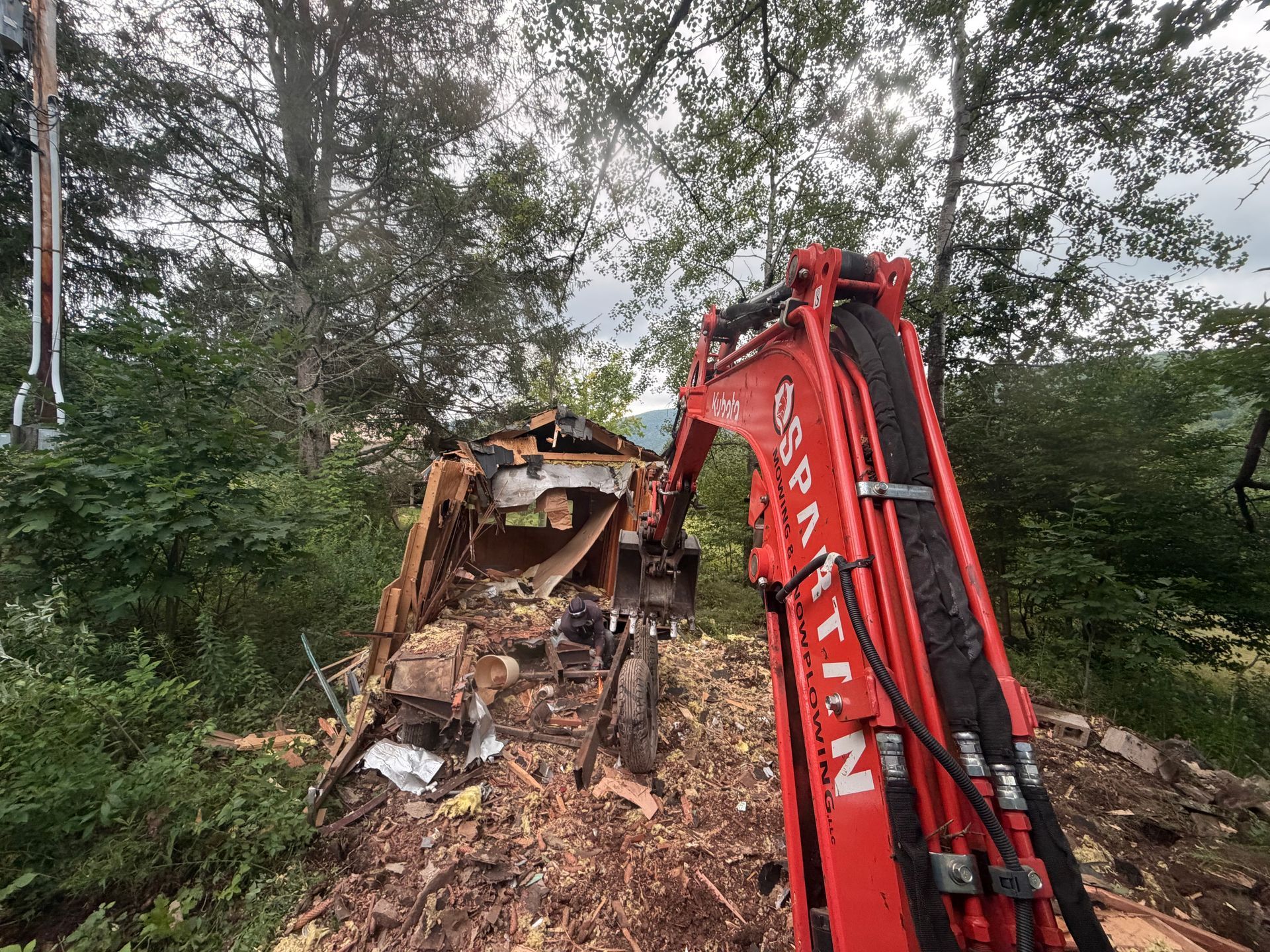 Heavy Equipment demolishing a mobile home POV