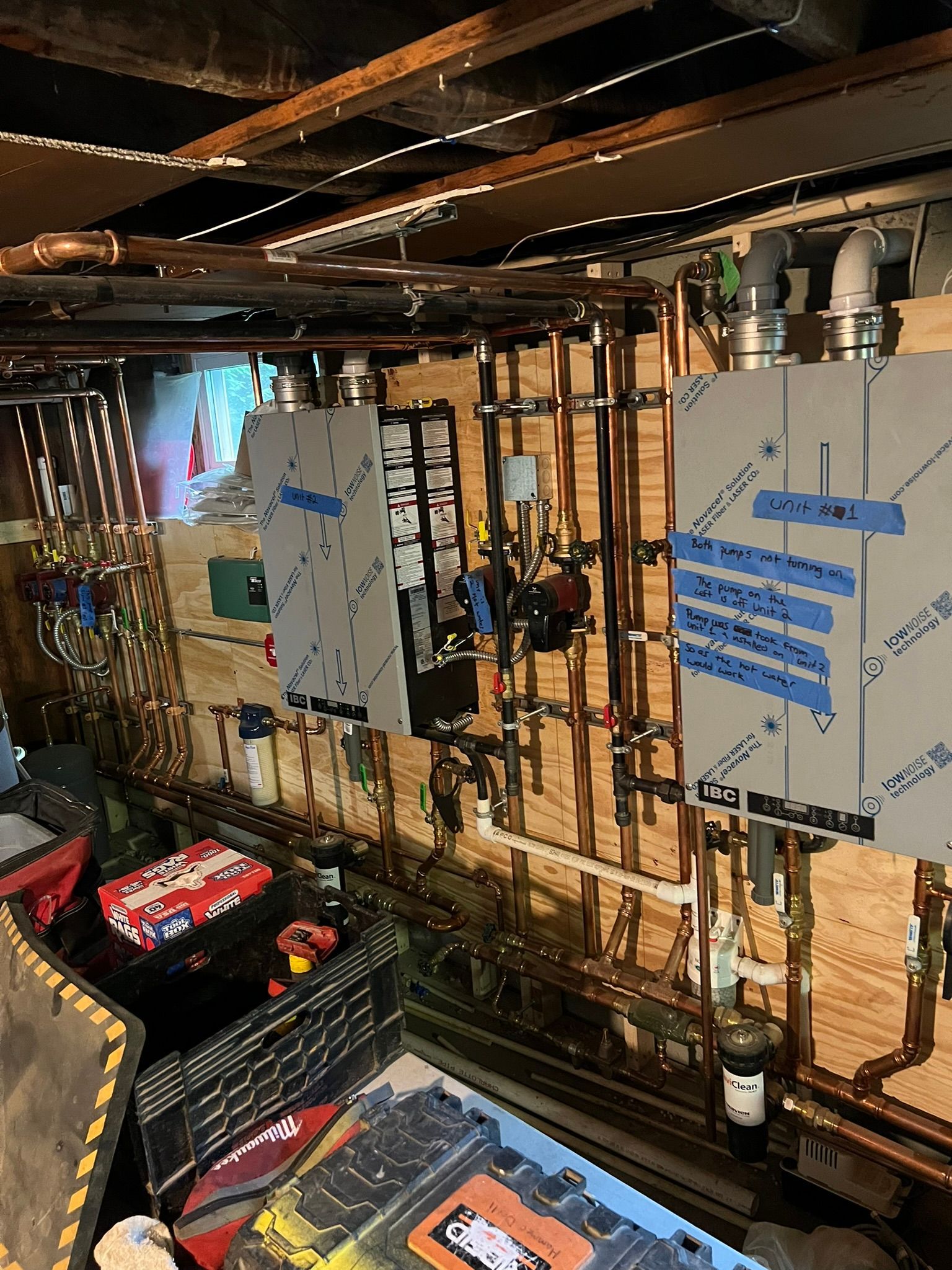 a room with a lot of pipes and tools on the wall