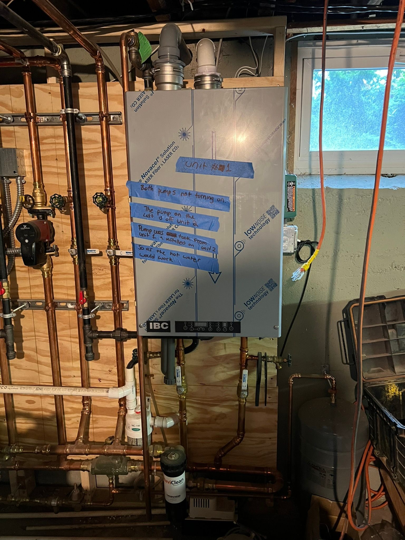 a water heater is being installed in a basement