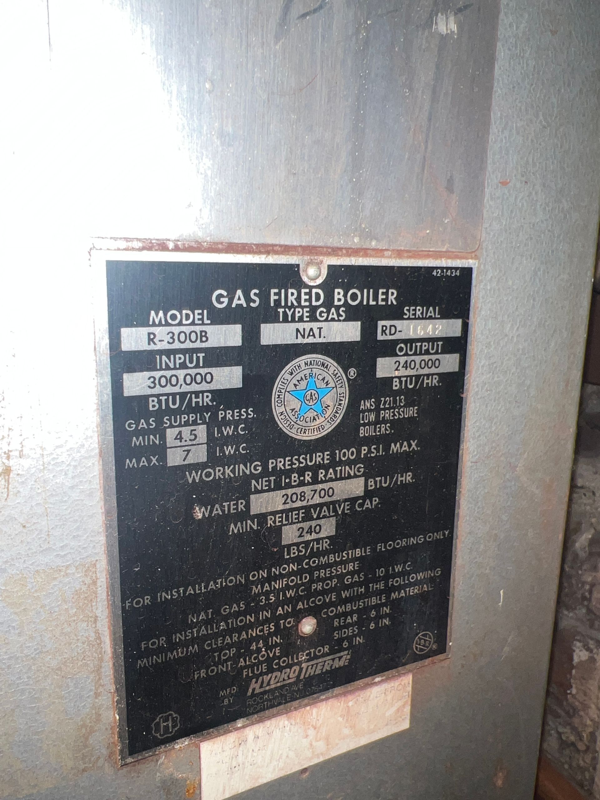 the back of a gas fired boiler with a label on it