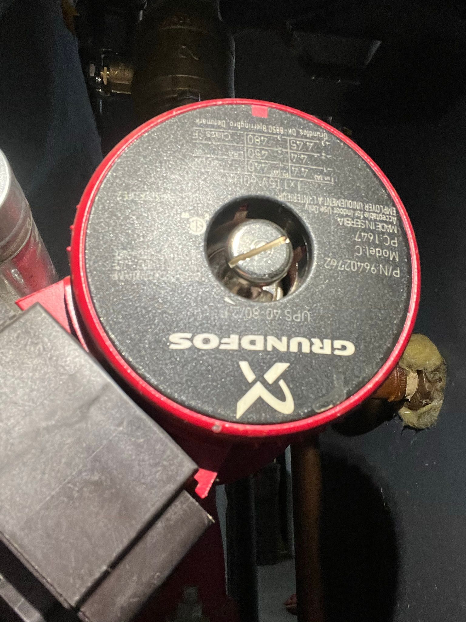 a close up of a red and black grundfos pump