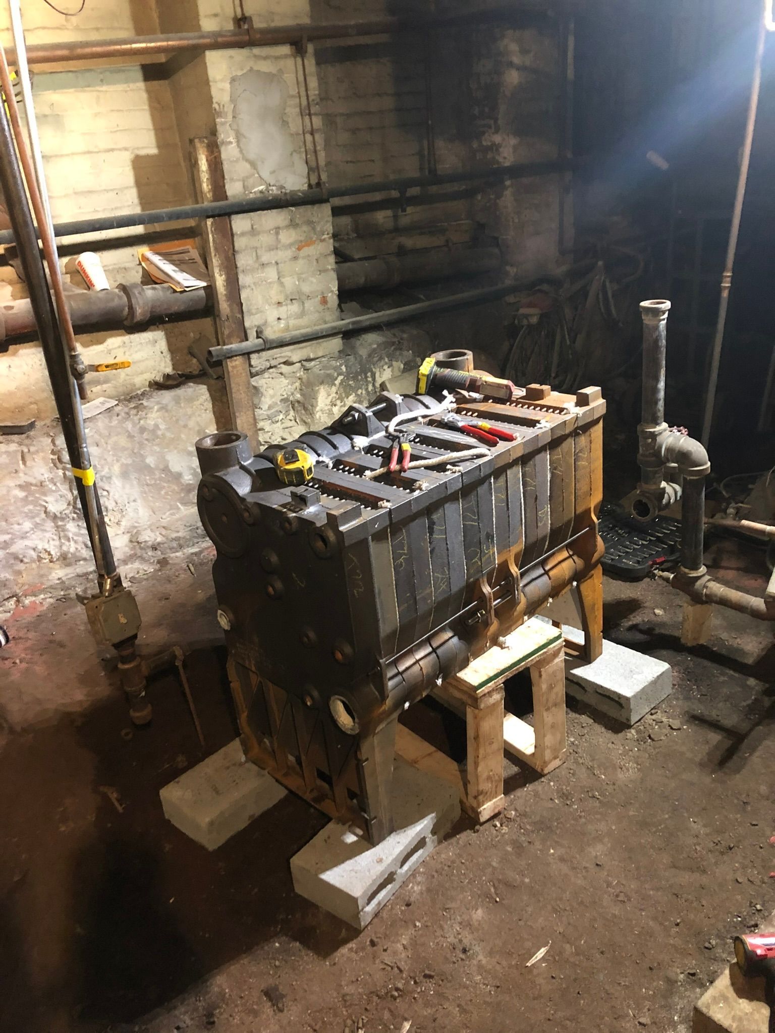 a large battery is sitting on top of a wooden table in a dark room