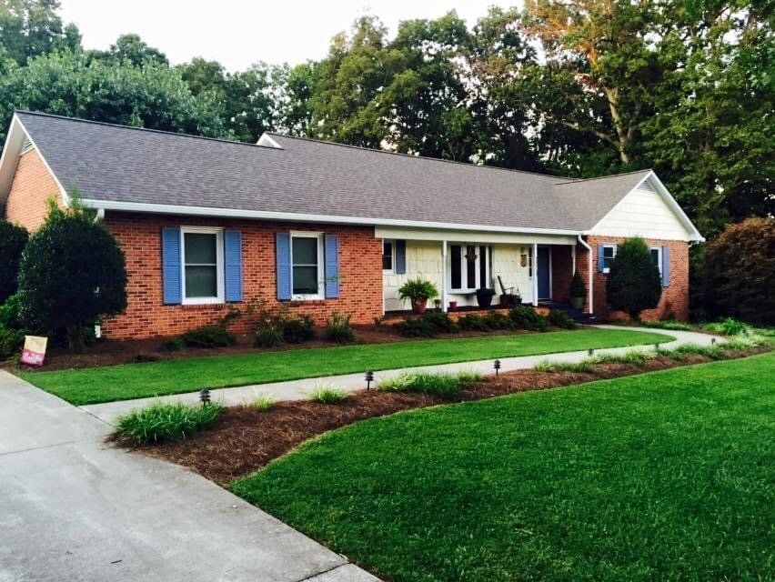 House with shingle roofing