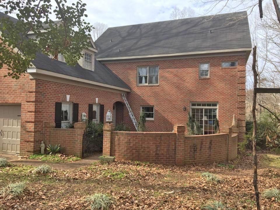 Brick house with asphalt roofing