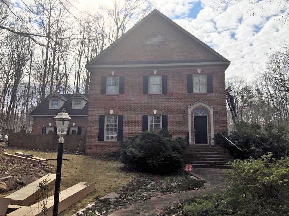 House with a lot of windows and brick walls