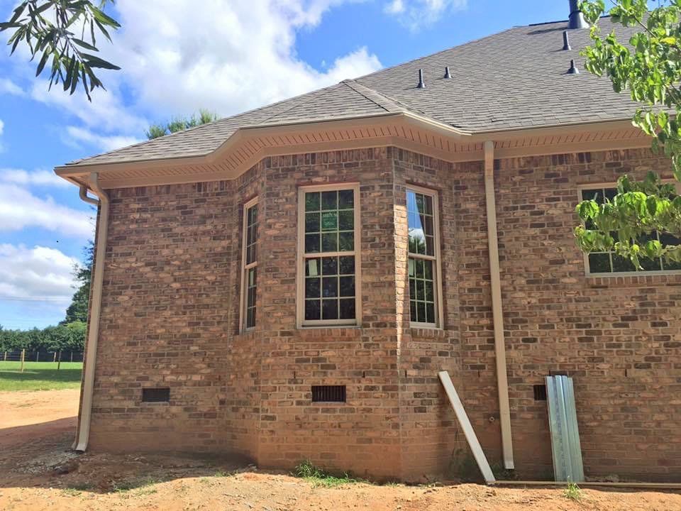 Side of the house with three windows