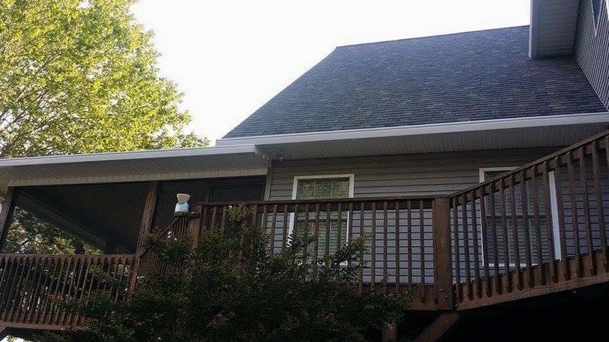 House with a deck and gutter