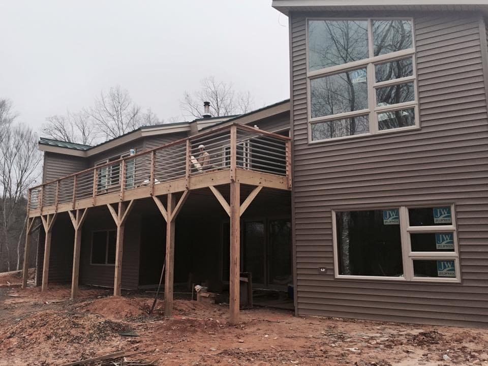 House with big windows and sidings