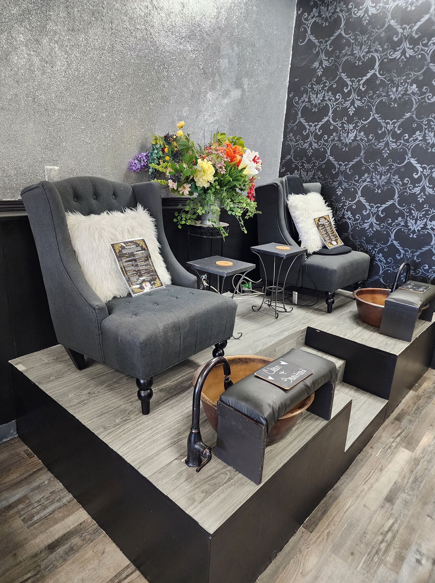 There are two chairs and a foot spa in the room.