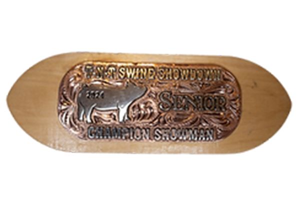 A belt buckle with a picture of a cow on it
