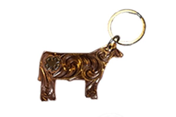 A key chain in the shape of a cow on a white background
