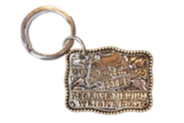A key chain with a buckle on it that says reserved for cowboys