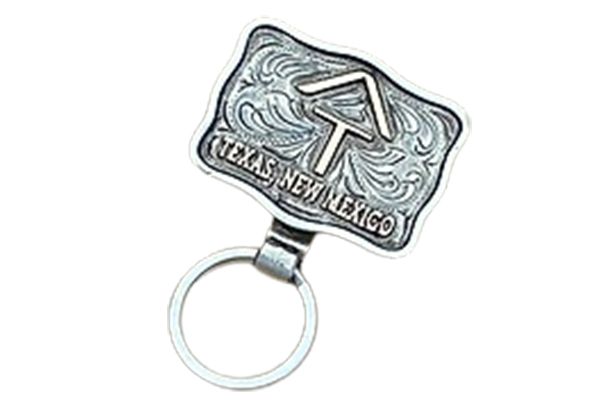 A key chain with a texas new mexico belt buckle on it.