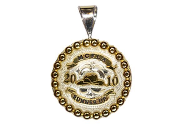 A pendant that says runner of the year on it