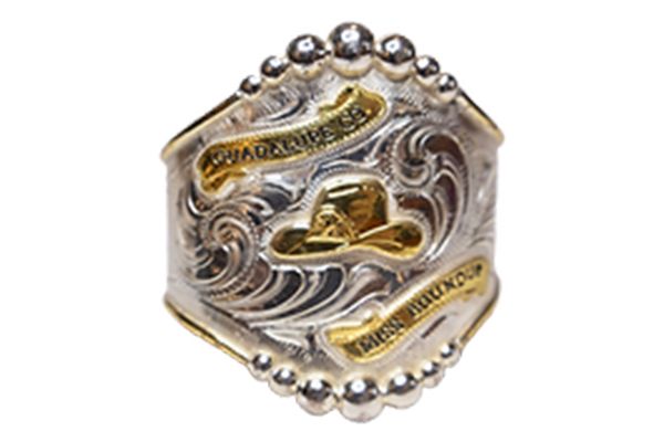 A silver and gold ring with a cowboy hat on it