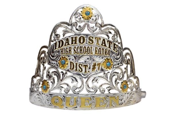 A silver and gold tiara that says idaho state high school rodeo