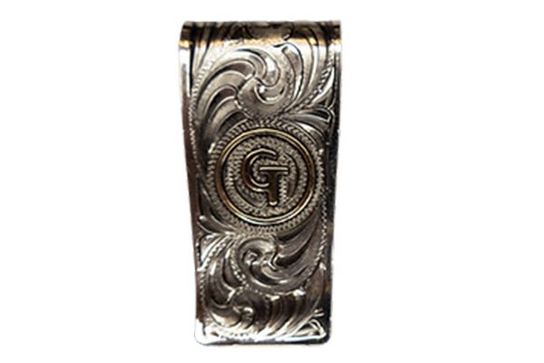 A silver money clip with a g on it on a white background.
