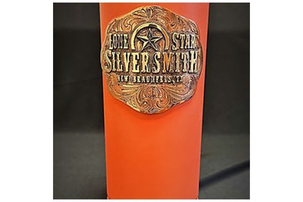 A red cup with a buckle that says lone star silversmith