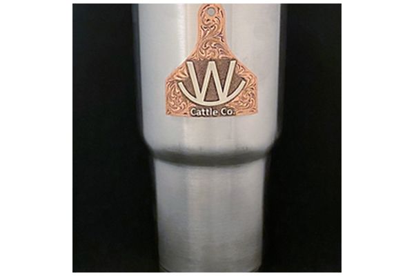 A stainless steel tumbler with a logo on it.