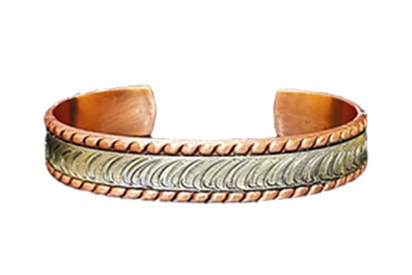 A close up of a copper bracelet on a white background.