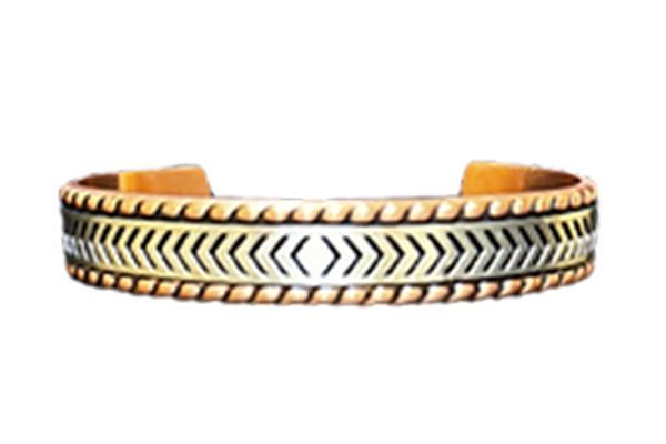 A close up of a copper bracelet on a white background.