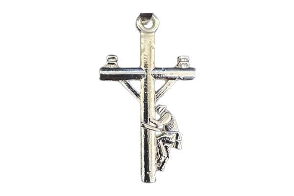 A silver cross with jesus on it on a white background.