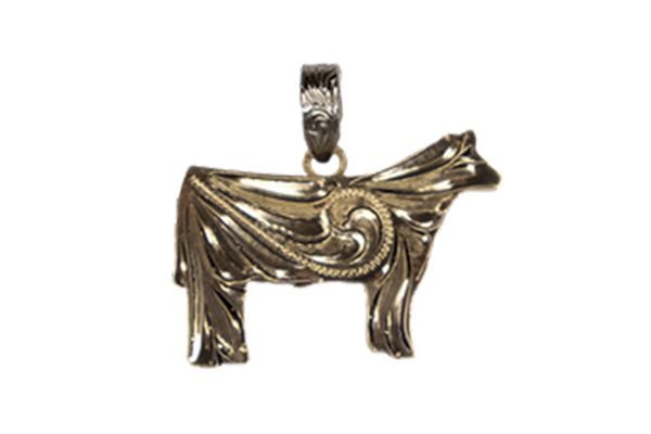 A silver pendant in the shape of a cow on a white background.